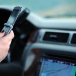 Car driver texting and driving - Premier Law group Personal Injury Attorney