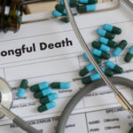 Wrongful death documents with a stethoscope and medication.