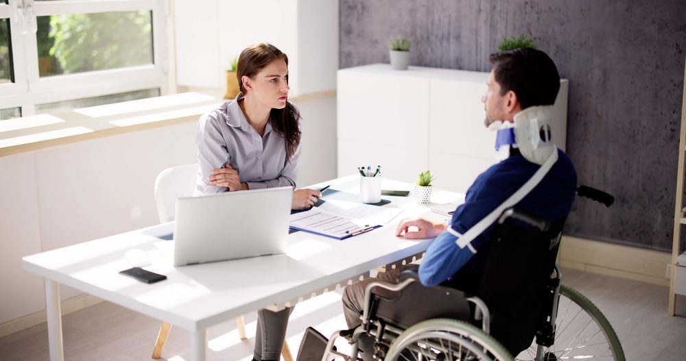 Person dealing with injuries who is discussing their case with a lawyer and is concerned about whether they will have to pay taxes on a personal injury settlement