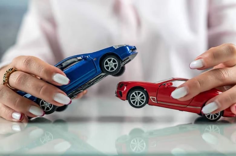 A man recreating a car accident with toy cars. How to claim lost wages from a car accident in WA.