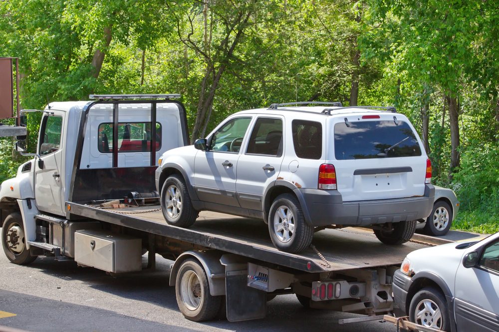 Cars being towed after a mult-car accident in WA. Whose insurance pays?